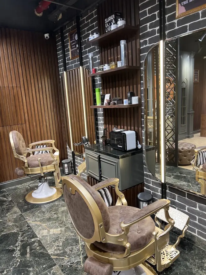 Barber stations with gold chairs