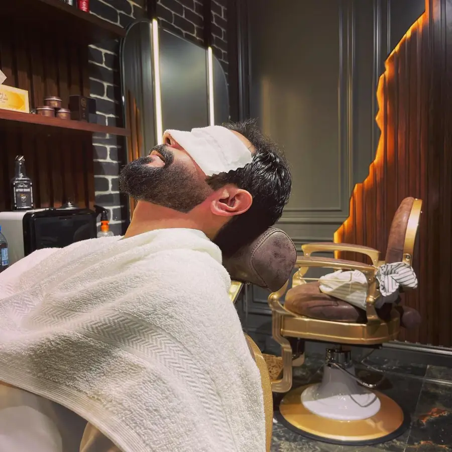 A client under a hot towel at Fine Cuts